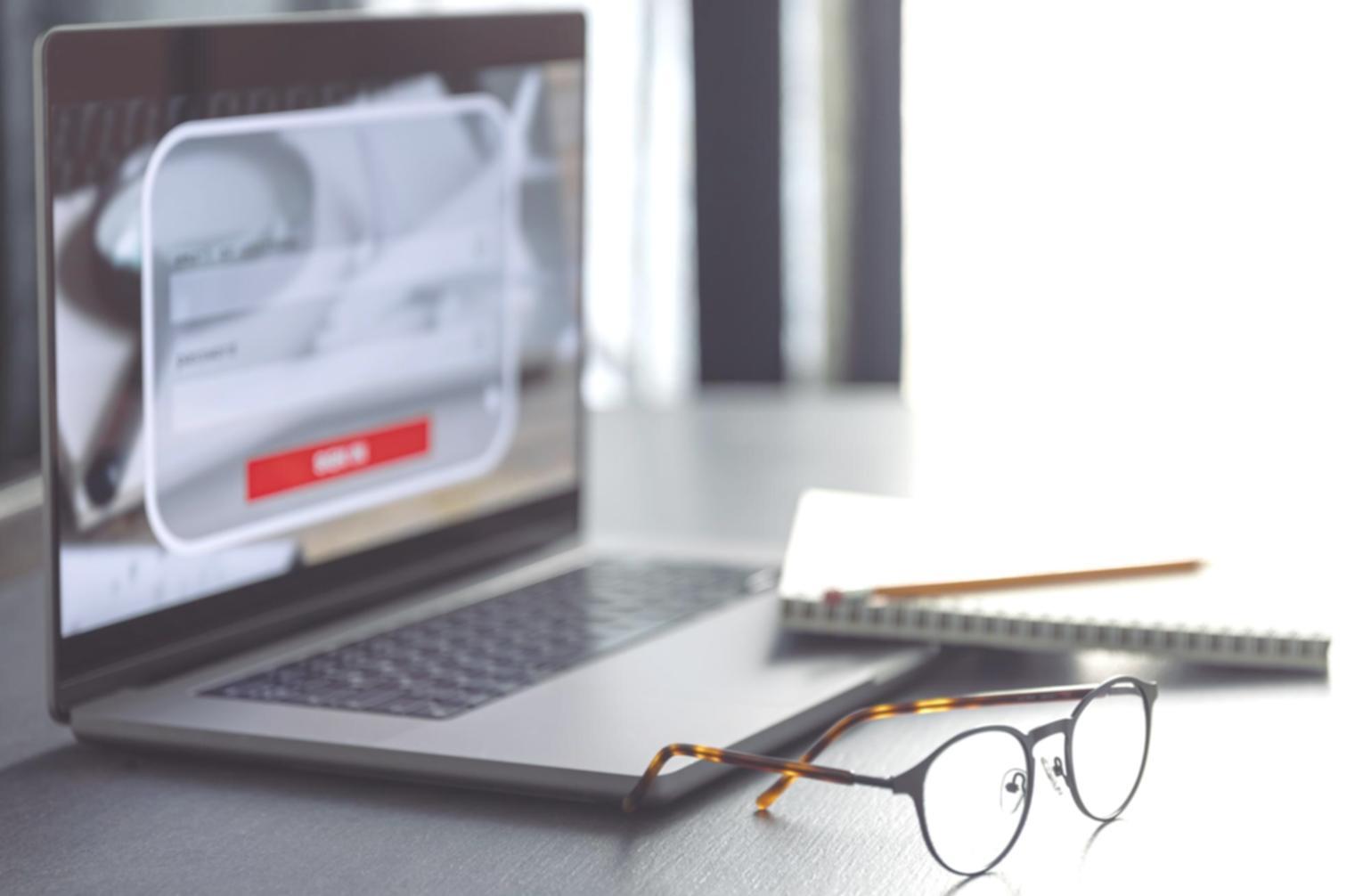Business professional reviewing automated financial reports on computer